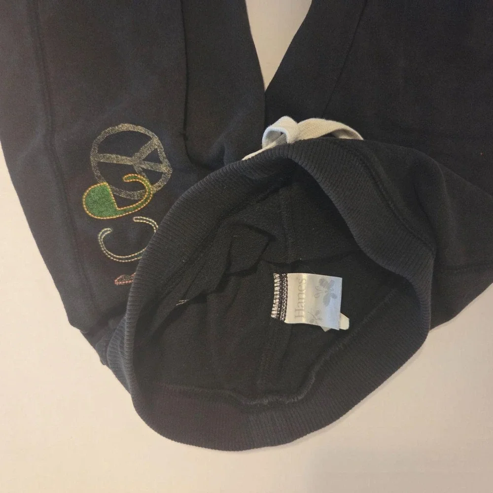Super cozy black Hanes sweat shorts featuring a vibran